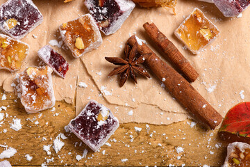 Wall Mural - Sweet food Turkish delight on wooden background, assorted locum and candy as decorated backdrop