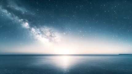 Milky way shines brightly above serene ocean at night
