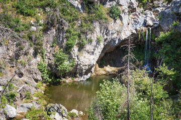 Wall Mural - June 2024, the once gorgeous area around the waterfall of Drimonas river in North Evia, with many burnt trees, three years after the disastrous wildfires of August 2021