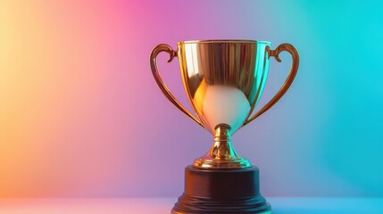 A championship gold cup trophy with curved handles on a dark wooden base