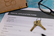 © gamerxtc - Rental application form with keys and glasses on table
