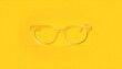 © lina - amber -frame eyeglasses on yellow background