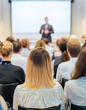 © lina - attentive audience listening to a presentation in a conference room