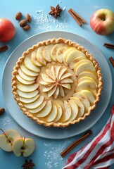 Wall Mural - Deliciously Crafted Apple Tart Surrounded by Fresh Ingredients and Spices on a Light Blue Background Perfect for Baking Enthusiasts and Food Photography