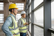© zhu difeng - two asian male engineer working in construction site