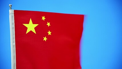 Wall Mural - Chinese flag waving on blue sky background