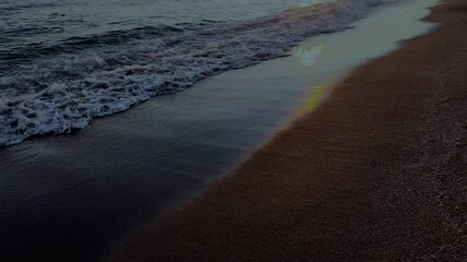Wall Mural - waves crashing against the seashore at night