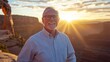 © Nurul - Senior man smiles at sunset over natural arch. Possible use Stock photo for travel and lifestyle