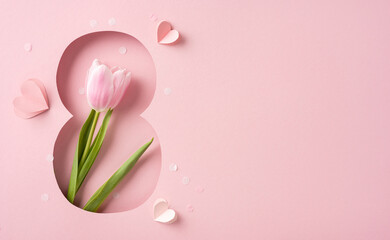 Wall Mural - Delicate pink tulip flower with heart shapes on a soft pink background, symbolizing love and celebration, perfect for honoring special occasions such as Women's Day and expressing romantic themes