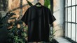 © pier - plain black t-shirt hanging indoor natural light plants oversized casual soft fabric