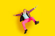 © deagreez - Full length photo of attractive retired man jump falling flight dressed stylish colorful pink fancy clothes isolated on yellow background