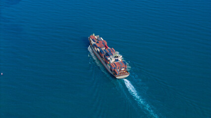 Wall Mural - Top view Container ship full capacity approaching port International Container ship loading, unloading at sea port, Freight Transportation, Shipping,Logistics, import export, Transportation. Global