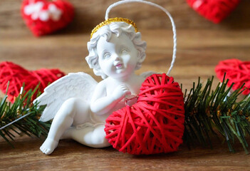 Wall Mural - a close-up image of a charming cupid-themed garland, showcasing cupid with his bow and arrows as the