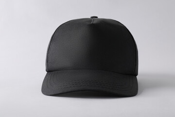 Wall Mural - Stylish black baseball cap on light grey background, closeup. Mockup for design