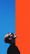© Vilius - Conceptual Minimalist Composition Featuring Silhouetted Human Profiles Against a Divided Background of Vibrant Blue and Orange