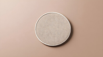 plain monochromatic circular patch mockup placed on a flat neutral background for versatile embroide