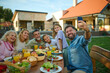 © Zamrznuti tonovi - Happy family taking a selfie while having lunch in the backyard