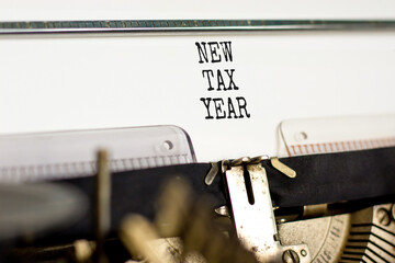 New tax year symbol. Concept words New tax year typed on beautiful old retro vintage typewriter. Beautiful white background. Business new tax year concept. Copy space.