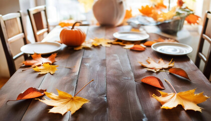 Canvas Print - Empty rustic wooden table with autumn-colored leaves scattered across it, ready for a Thanksgiving feast, soft natural light filtering through the window.