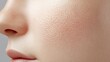 © Moopingz - Close-up of woman's cheek, showing detailed skin texture, pores and fine vellus hair, part of nose and lips visible.