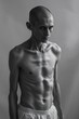 © Kseniia - Emaciated young man in black and white photography showcasing extreme thinness