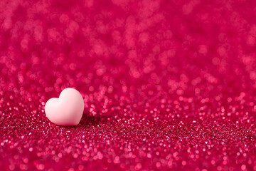 Wall Mural - Pink decorative heart on shiny crimson background, space for text. Happy Valentine's day