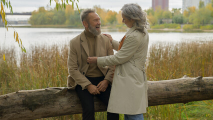 happy family caucasian mid age couple female male rest together autumn weekend senior man talking to