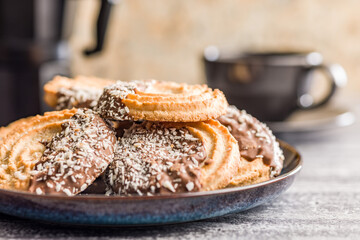 Wall Mural - Sweet chocolate cookies on plate on kitchen table.