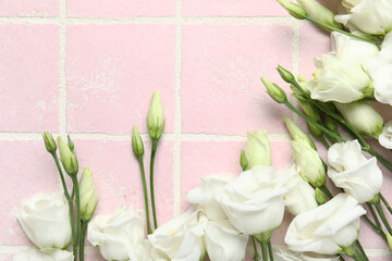 Wall Mural - White eustoma flowers on color tile background, closeup