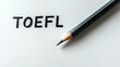 © I LOVE CUTE PNG`S - Sharpened pencil beside bold 'TOEFL' on white paper
