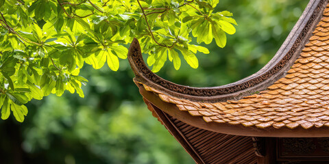 Roof of a traditional pagoda against the background of nature and trees, Hindu or Buddhist temple