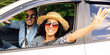 © Prostock-studio - Cheerful middle-eastern loving couple millennial handsome guy and pretty long-haired lady going to beach by auto, wearing sunglasses and summer hat, enjoying warm sunny days, smiling and waving