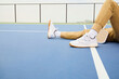© joescarnici - Mens legs on a pickleball court