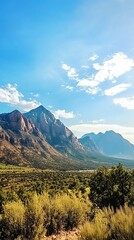 Wall Mural - Breathtaking Mountain Landscape Under Blue Sky with Green Foilage