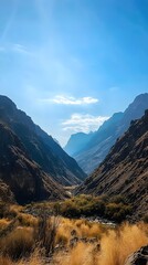 Wall Mural - Serene Mountain Valley with Clear Blue Sky and Lush Greenery