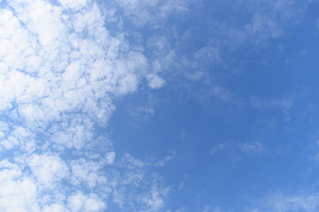 Wall Mural - beautiful blue sky and white fluffy group of clouds with sunrise in the morning, natural background