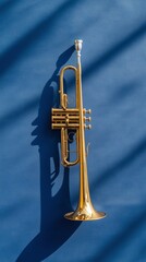 Poster - Brass Elegance Wall Art Gold Trumpet on Blue Background for Modern Office Decor - Musical Tradition in Corporate Event Design and Ceremonial Aesthetics