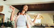 © peopleimages.com - Woman, happy and dancing in home with music, relax and comic in living room with memory in morning. Person, girl and smile with rhythm, excited and talent with joke, crazy and playful at apartment