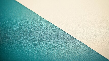 Wall Mural - Textured teal surface meets soft beige background creating a calming minimalist design. AI Generated