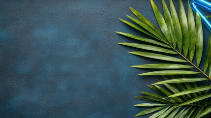 Wall Mural - Vibrant Green Palm Leaves on Dark Blue Textured Background