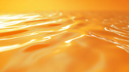 Abstract golden liquid surface with gentle ripples and bright highlights, creating a warm, inviting, and dynamic visual effect.