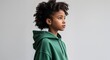 © sevenSkies - Black African girl green hoodie young teen side view portrait on plain white background