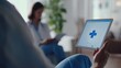 © felix_brönnimann - Telemedicine consultation with healthcare professional using tablet in modern clinic setting for remote patient care and digital health services