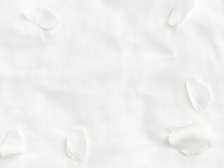 Poster - White petals scattered on soft white background