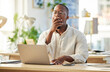 © Nina Lawrenson/peopleimages.com - Black man, laptop and tired yawn in office, employee and brain fog burnout for typing report. Exhausted, boring task and professional fatigue in workplace, low energy and online for graphic design