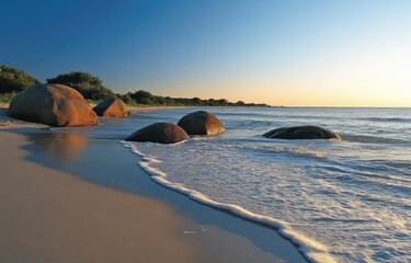 Canvas Print - Sunrise beach rocks, gentle waves, coastal serenity, tranquil scene