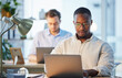 © Nina Lawrenson/peopleimages.com - Laptop, business and man in office, planning for article and report for sports news Journalist, online reading and employees with pc, people and research for press release, editing and coworking