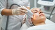 © Alexandr - Woman receiving facial treatment with a modern device for skincare