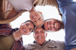 © Nina Lawrenson/peopleimages.com - Huddle, bonding and family with smile, portrait and love for mature parents on vacation and outdoor. Embrace, women and men with support for elderly people, retirement or reunion on holiday in Canada
