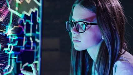 Young Female Programmer Analyzing Data on Futuristic Screen